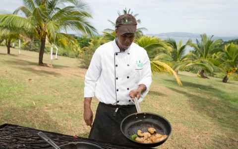 a man cooking food outside