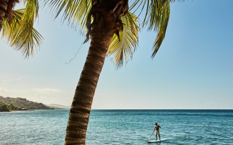a man on a surfboard in the water