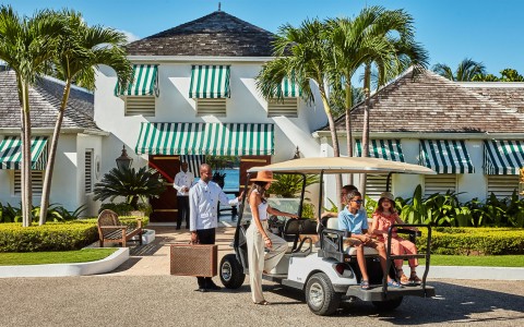 a group of people in a golf cart