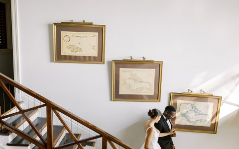 a man and woman walking up a staircase
