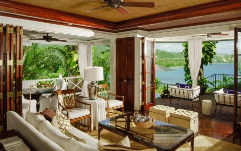 a living room with a view of the ocean