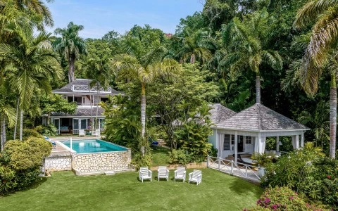 a pool in a yard with trees around it
