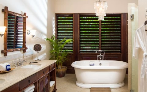 a bathroom with a tub and sink and a mirror