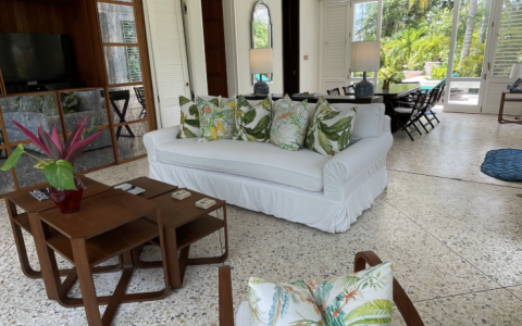 a living room with a white couch and a table