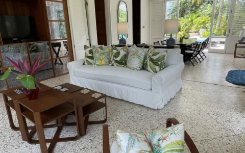 a living room with a white couch and a table