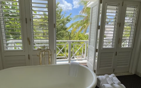 a bathtub and towels in a bathroom