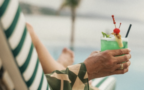 a person holding a drink