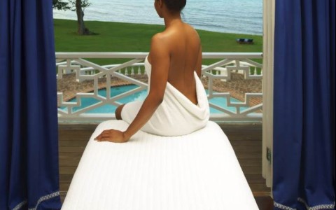 a woman sitting on a massage table
