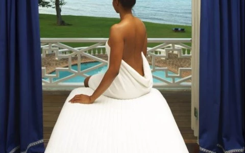 a woman sitting on a massage table