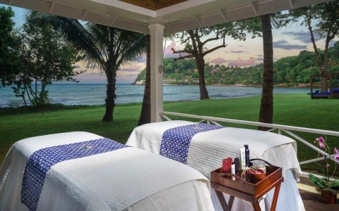 two beds outside with a view of the ocean