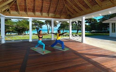 a man and woman doing yoga outside