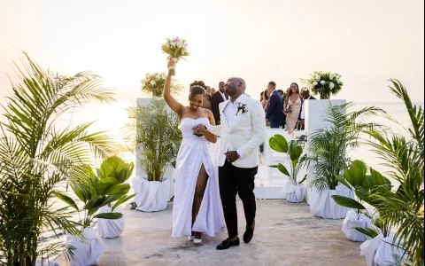 a man and woman walking down a dock