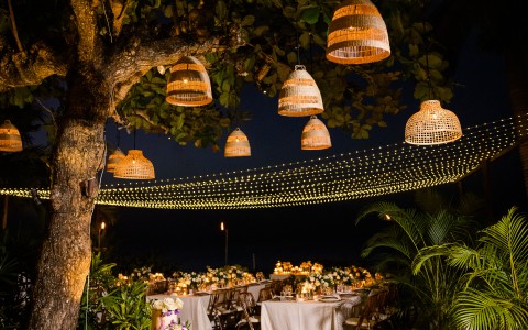 a tree with tables and lamps from it