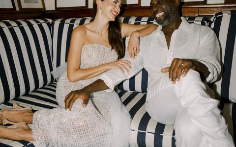 a man and woman sitting on a couch