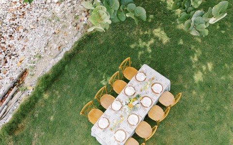 a table and chairs on grass