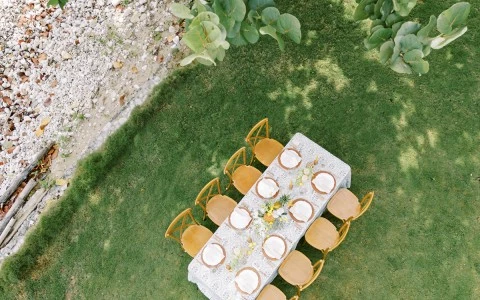 a table and chairs on grass