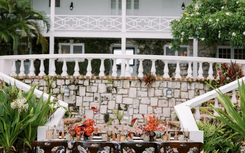 a table set for dinner in front of a house