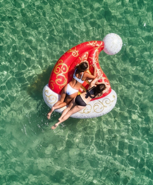 a group of women on an inflatable raft in the water