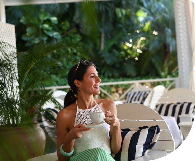 a woman holding a cup of tea