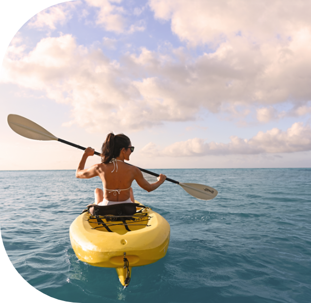 a woman in a yellow kayak