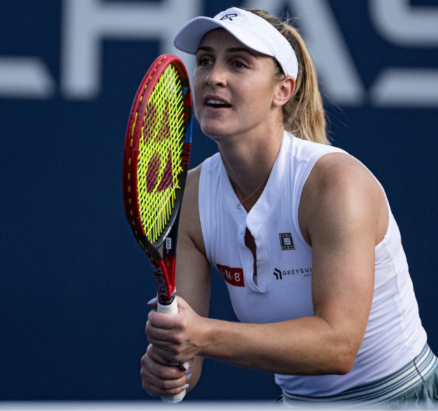 a woman holding a tennis racket