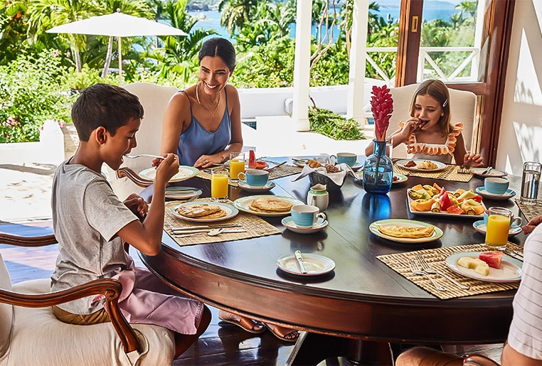 family eating breakfast at the table