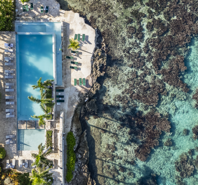a pool next to a body of water