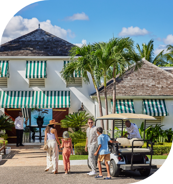 a group of people standing outside a hotel