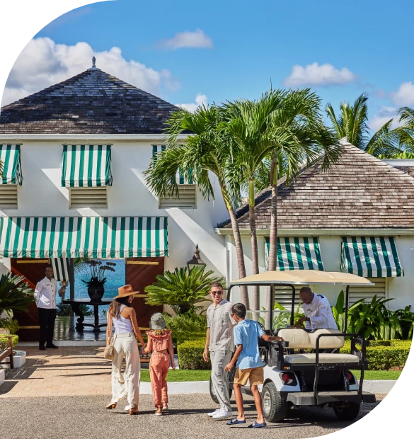 a group of people standing outside a hotel