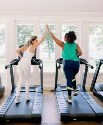 women giving each other a high five