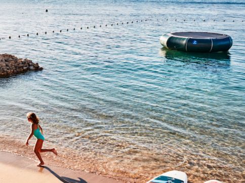 a woman running on a beach