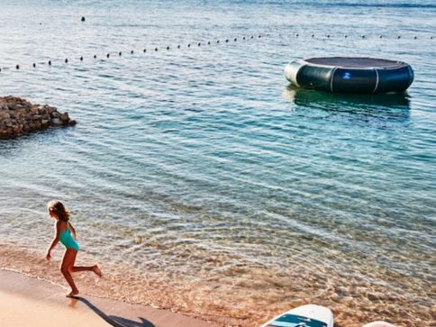 a woman running on a beach