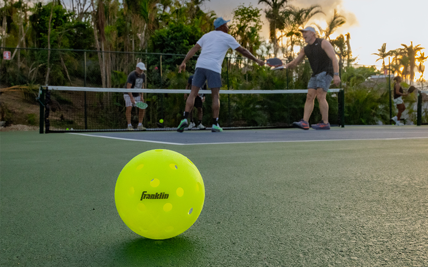 a group of men on a tennis court
