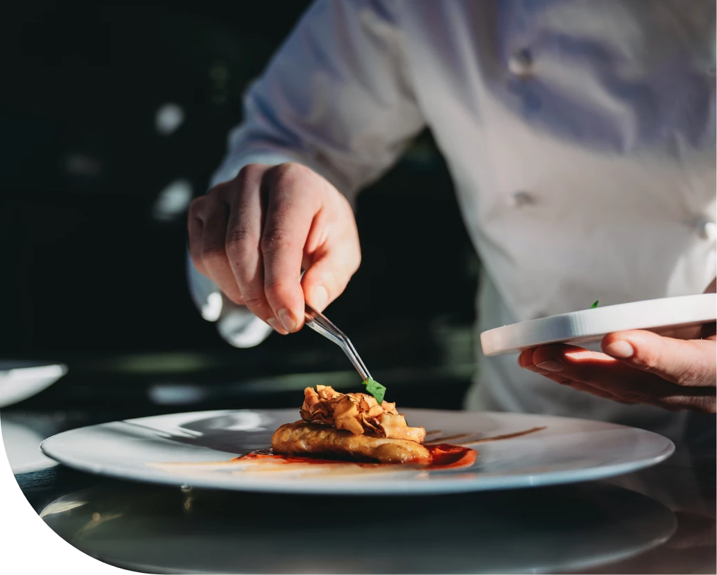 a person holding a plate of food
