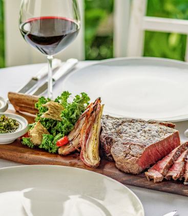 a plate of meat and vegetables on a table