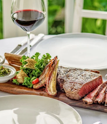 a plate of meat and vegetables on a table