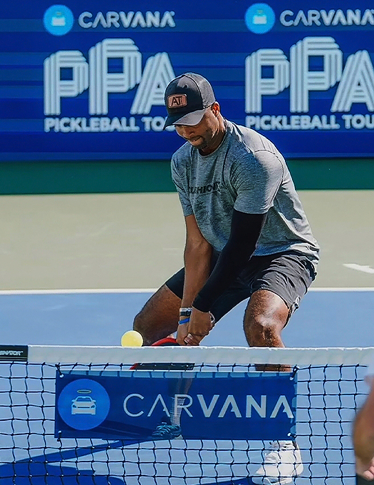 a man holding a tennis racket