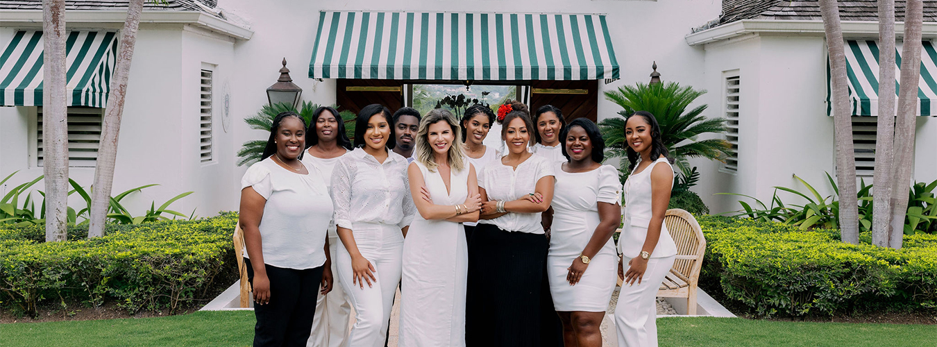 a group of women dressed in white