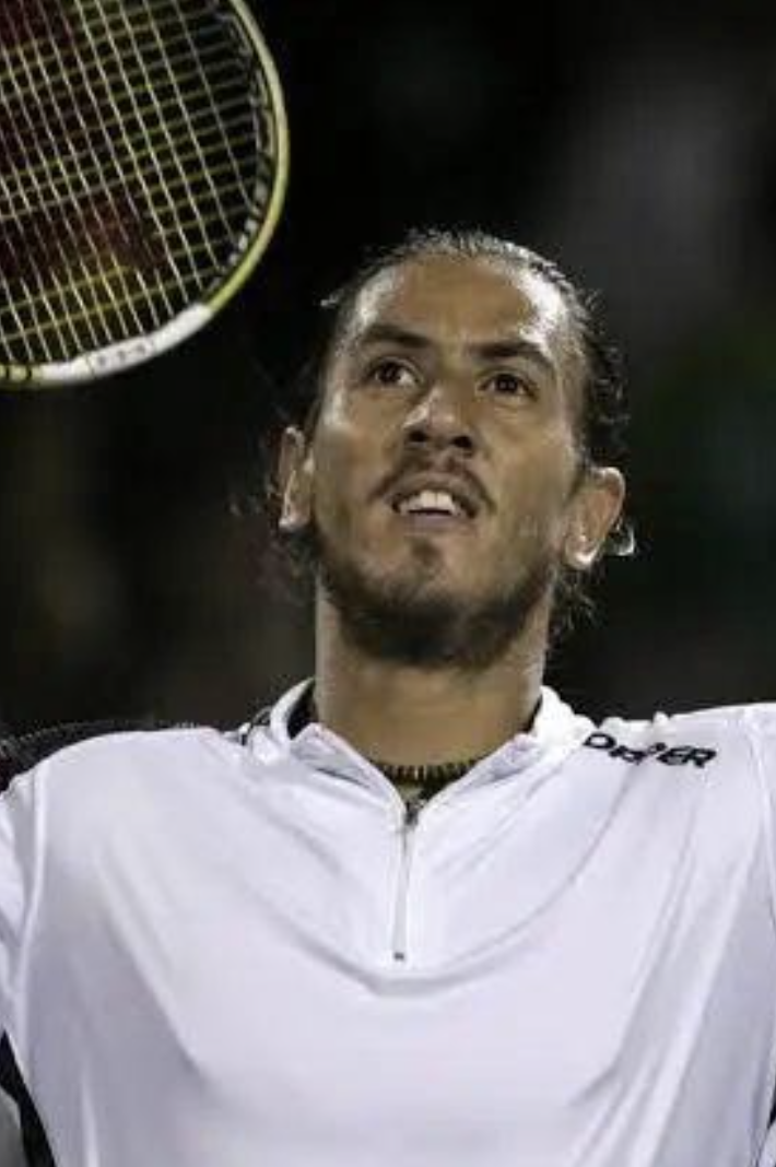 a man holding a tennis racket