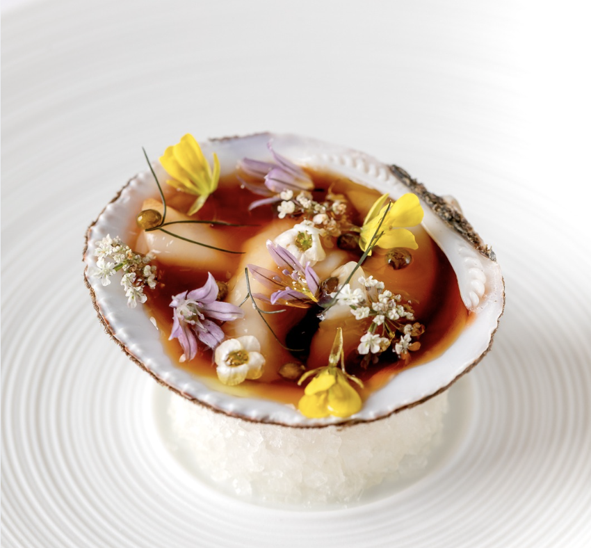 a plate of food with flowers on it