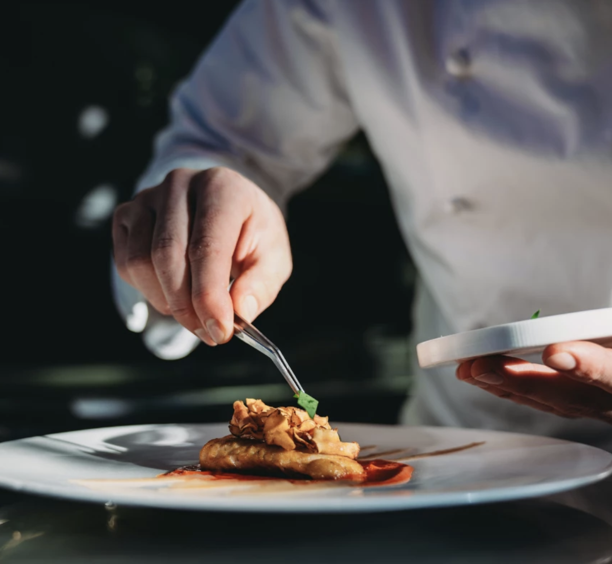 a person holding a plate of food
