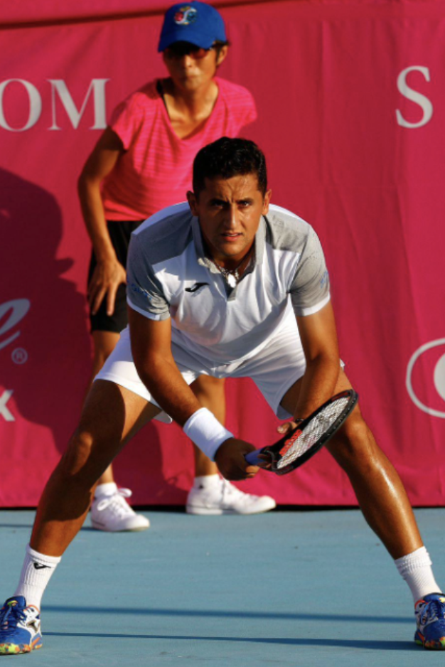 a man holding a tennis racket