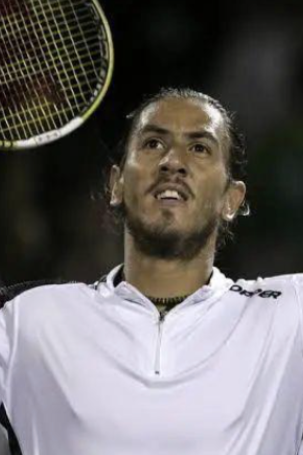 a man holding a tennis racket