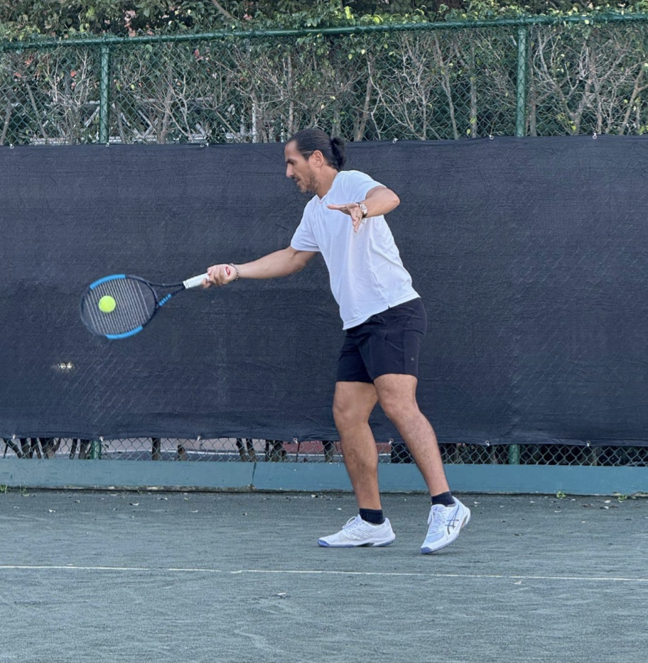a man swinging a tennis racket