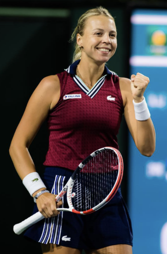 a woman holding a tennis racket