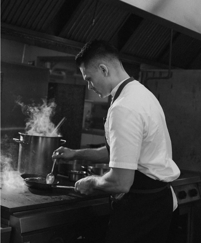 a man cooking in a kitchen