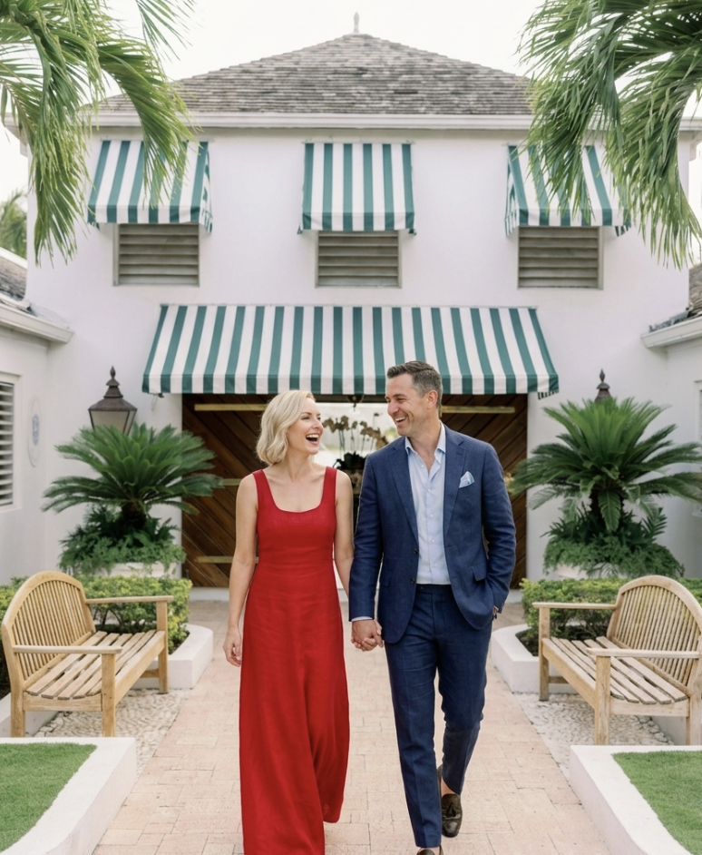 a man and woman holding hands and walking in front of a building