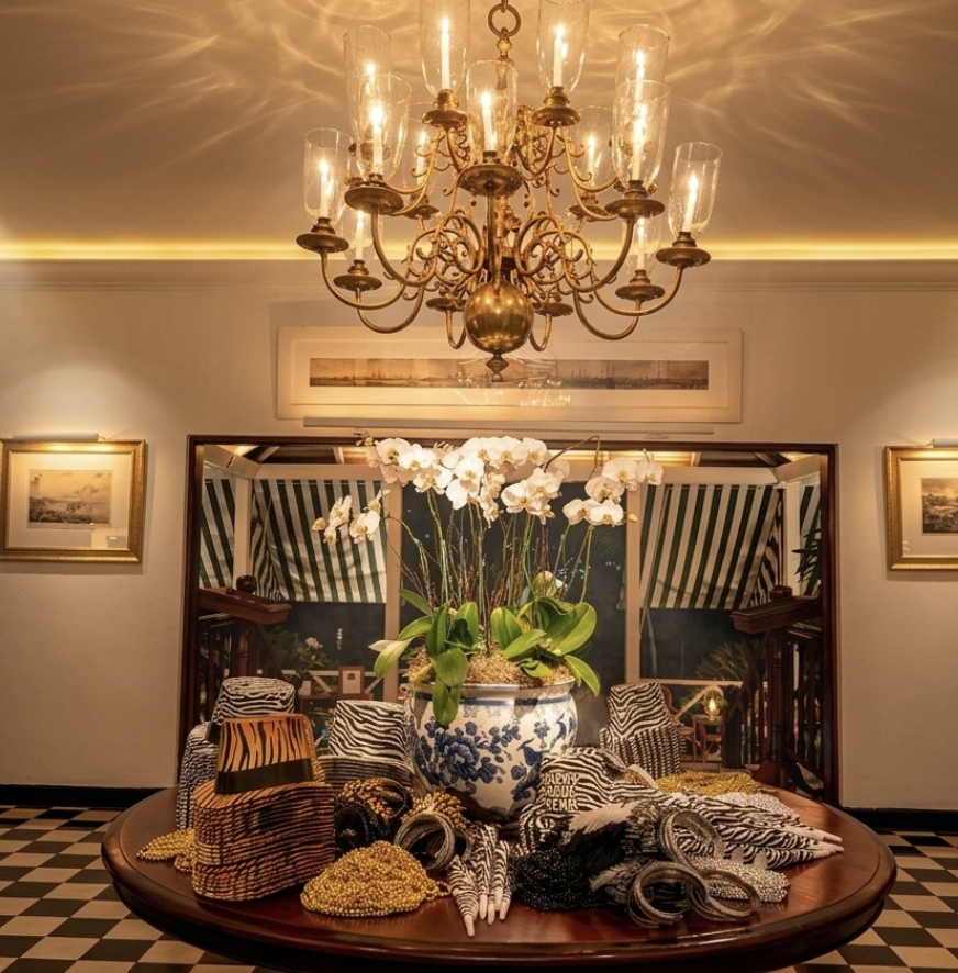 a chandelier over a table with flowers