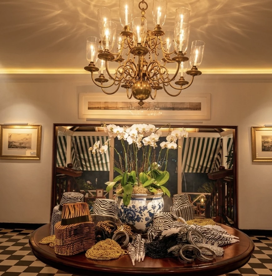a chandelier over a table with flowers