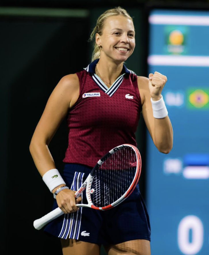 a woman holding a tennis racket